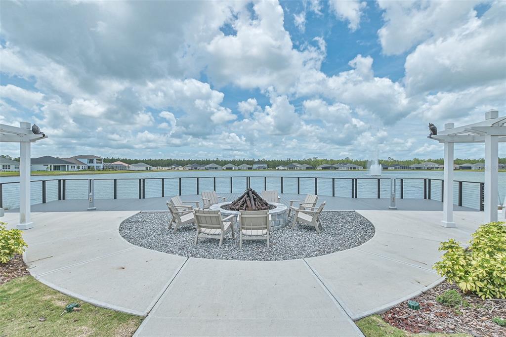 195 Azure Mist Way Daytona Beach, FL 32124 - Photo 6 of 63 an outdoor view with swimming pool and seating