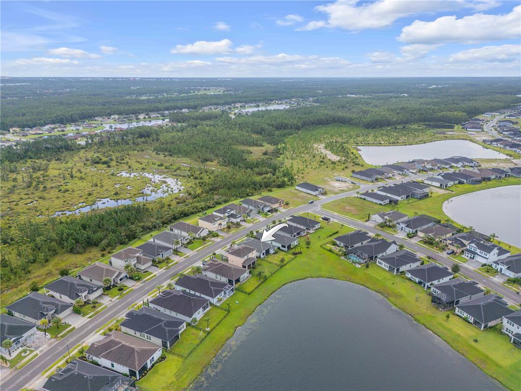 195 Azure Mist Way Daytona Beach, FL 32124 - Photo 63 of 63 a view of a lake with a mountain