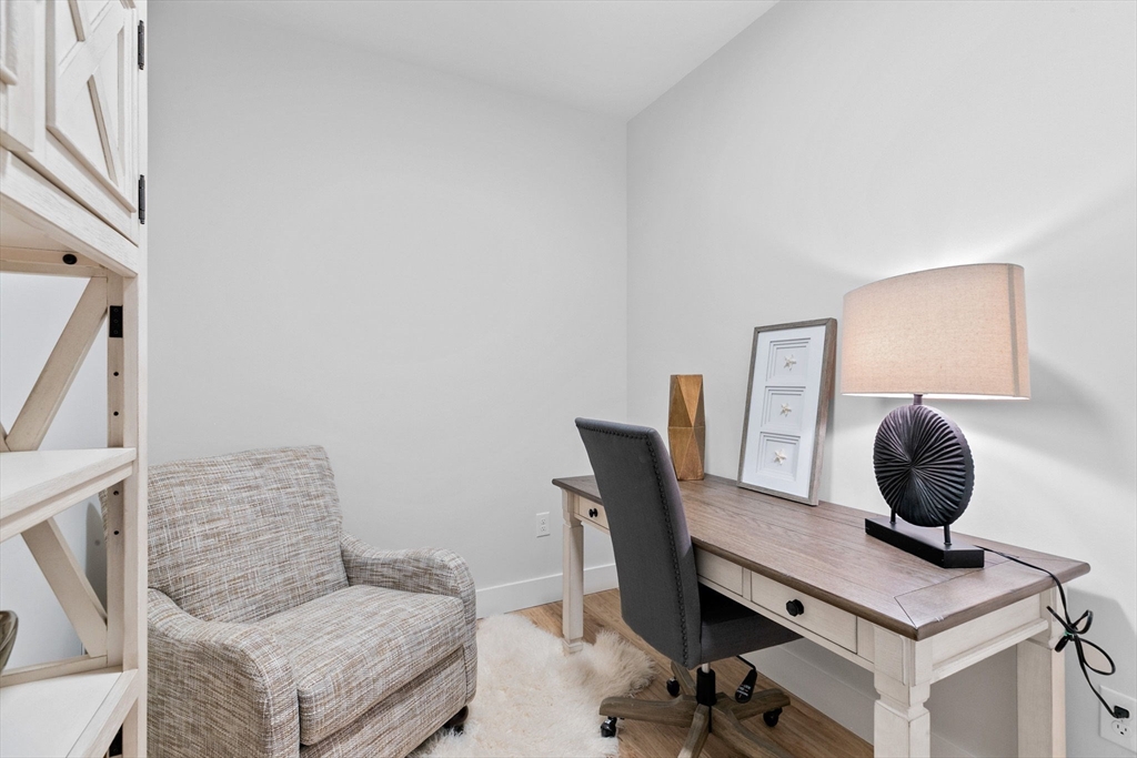 57 Long Point Road, Unit 309 Lakeville, MA 02347 - Photo 7 of 24 a view of a workspace with furniture and a couch