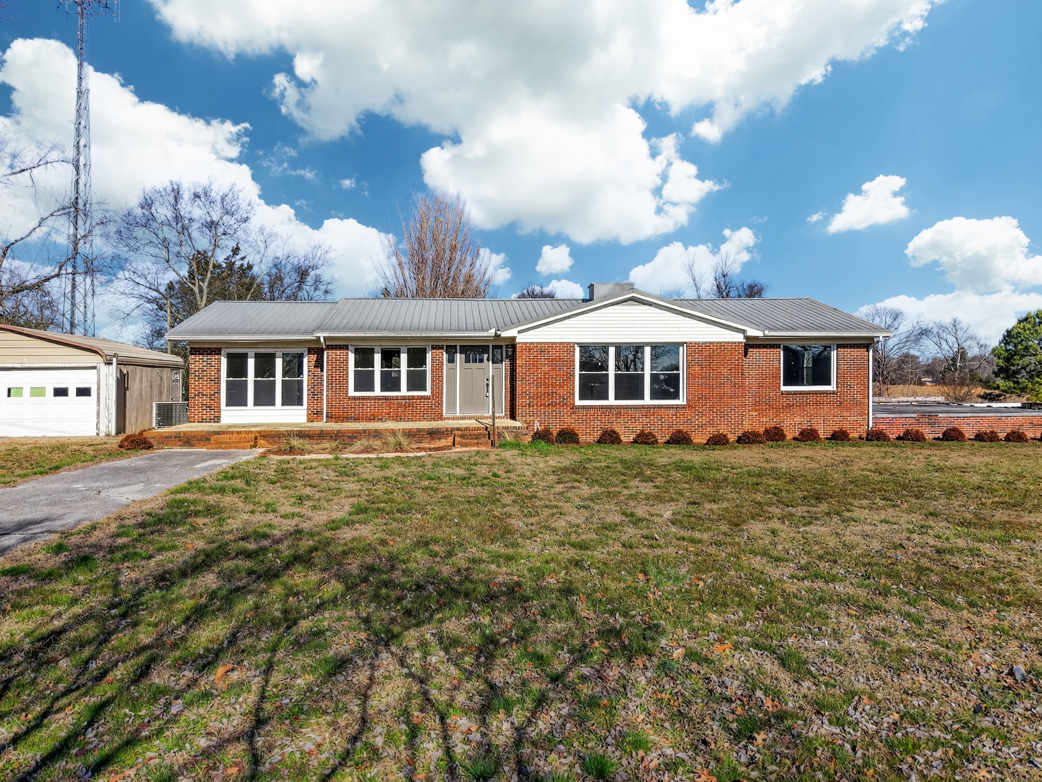 8 East Prospect Road Fayetteville, TN 37334 - Photo 2 of 42 a view of a house with a big yard and large trees
