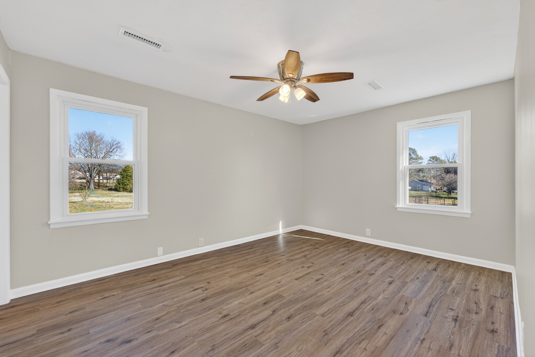 8 East Prospect Road Fayetteville, TN 37334 - Photo 22 of 42 a view of empty room with wooden floor and fan