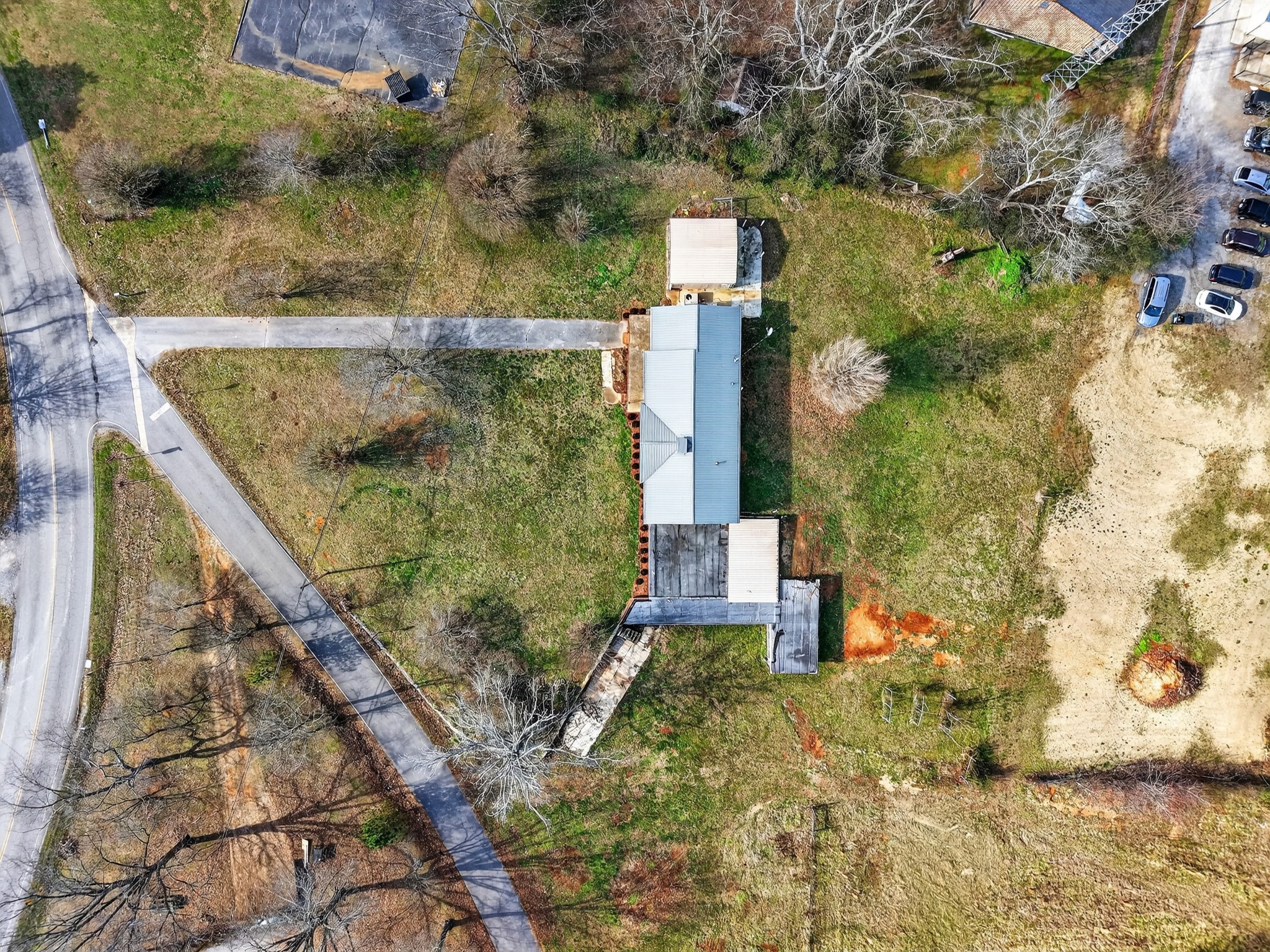 8 East Prospect Road Fayetteville, TN 37334 - Photo 38 of 42 a brick building with a yard and trees in the background