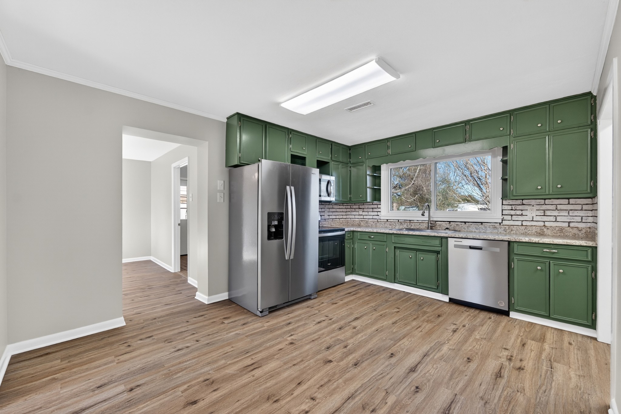 8 East Prospect Road Fayetteville, TN 37334 - Photo 10 of 42 a kitchen with a refrigerator and wooden cabinets