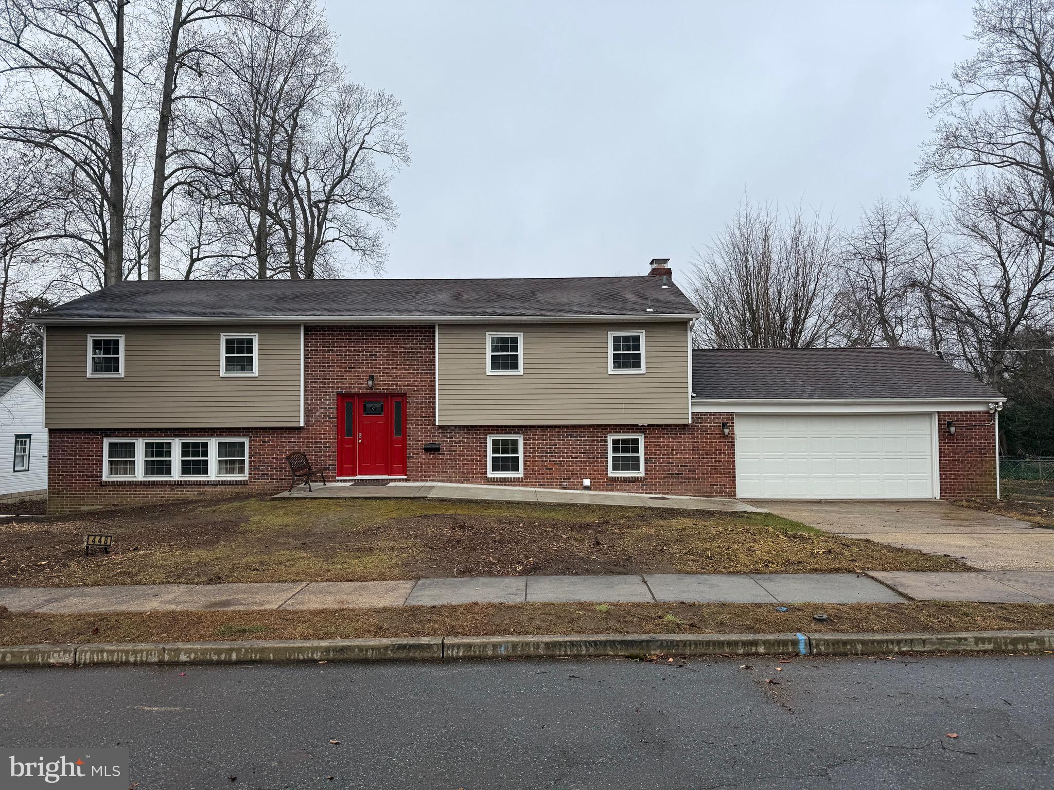 448 Lake Avenue Pitman, NJ 08071 - Photo 1 of 24 a front view of a house with a yard and garage