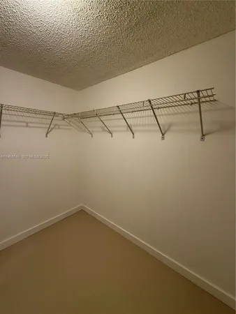 a view of a room with racks on the wall