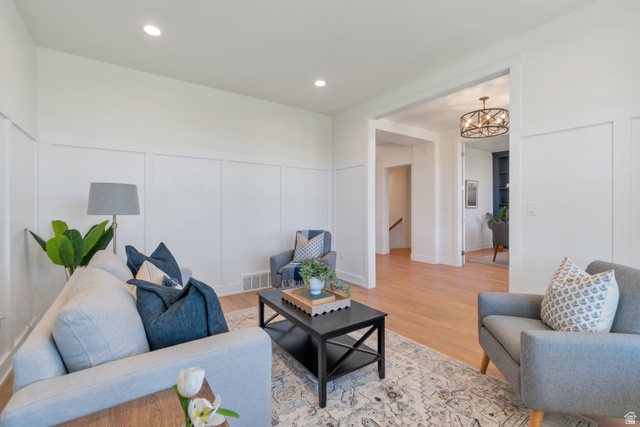 1820 West Farmhouse Flats Road Peoa, UT 84061 - Photo 8 of 79 Living area featuring wainscoting, recessed lighting, wood-finish flooring, and a wide entryway
