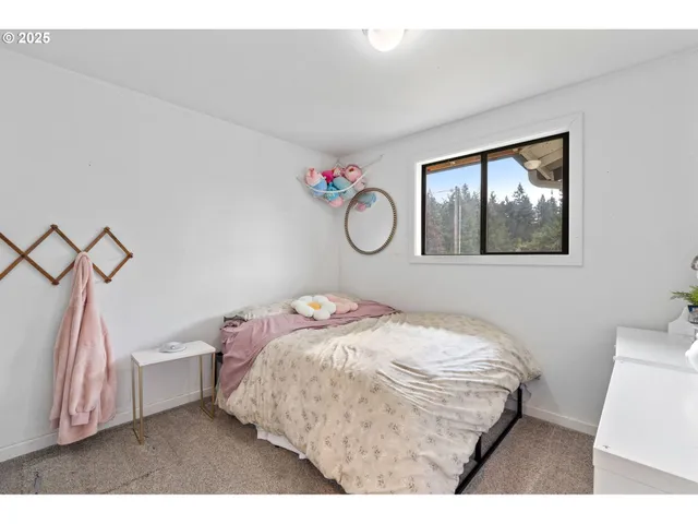 a bedroom with a bed and a cabinets