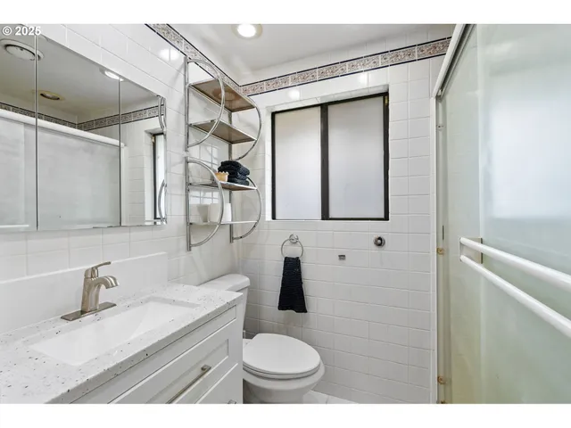 a utility room with sink dryer and washer