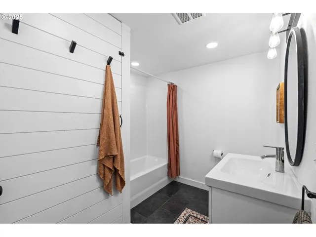 a view of a patio with a table chairs and a backyard