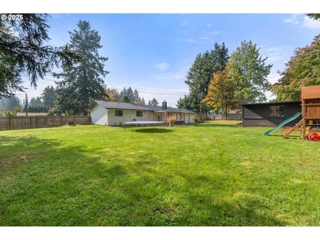 a view of a house with a big yard