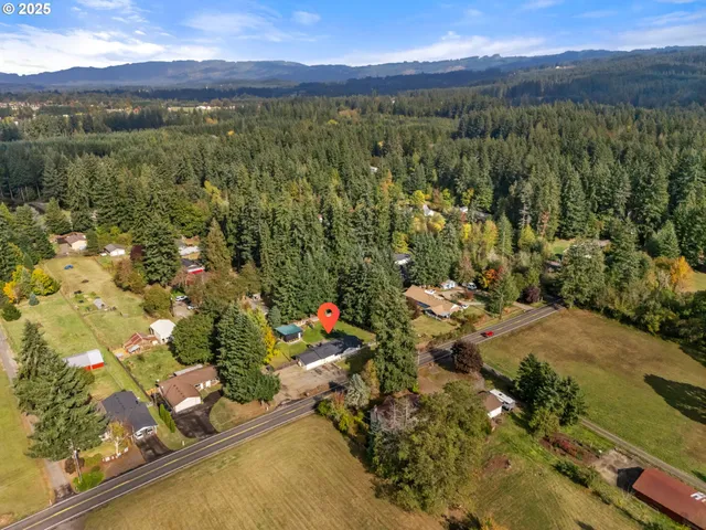 a front view of a house with a big yard