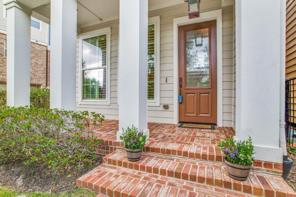 46 East Rafters Row The Woodlands, TX 77380 - Photo 2 of 25 Welcoming covered front porch—perfect for morning coffee or evening relaxation.