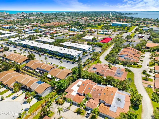 an aerial view of residential houses with outdoor space
