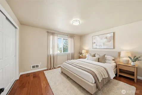 a bathroom with a sink toilet vanity and shower
