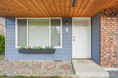 a view of a livingroom with furniture and a fireplace