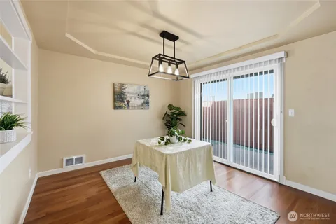 a view of an entryway with wooden floor