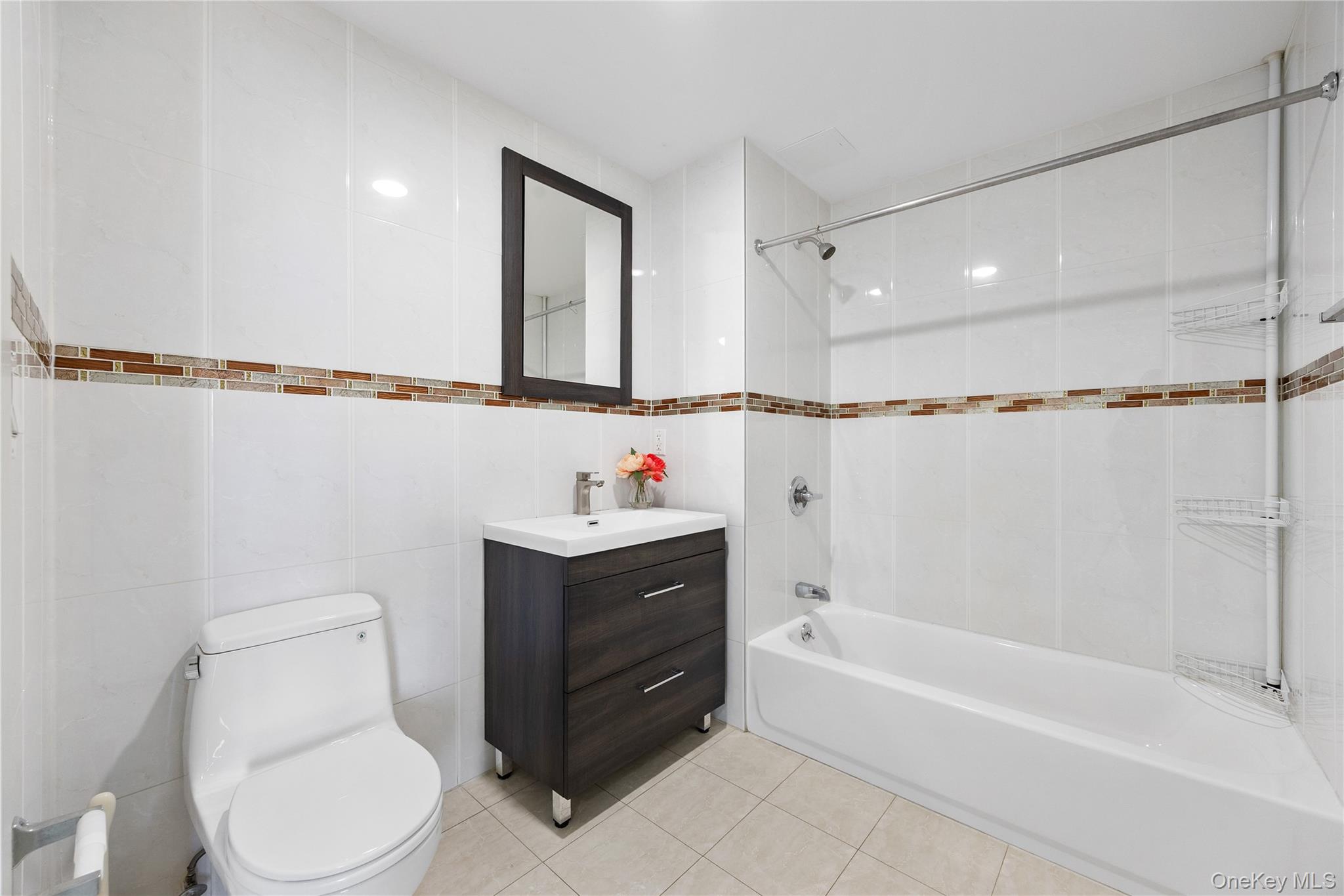 138-12 Northern Boulevard, Unit 5D Queens, NY 11354 - Photo 16 of 22 a bathroom with a sink toilet and shower