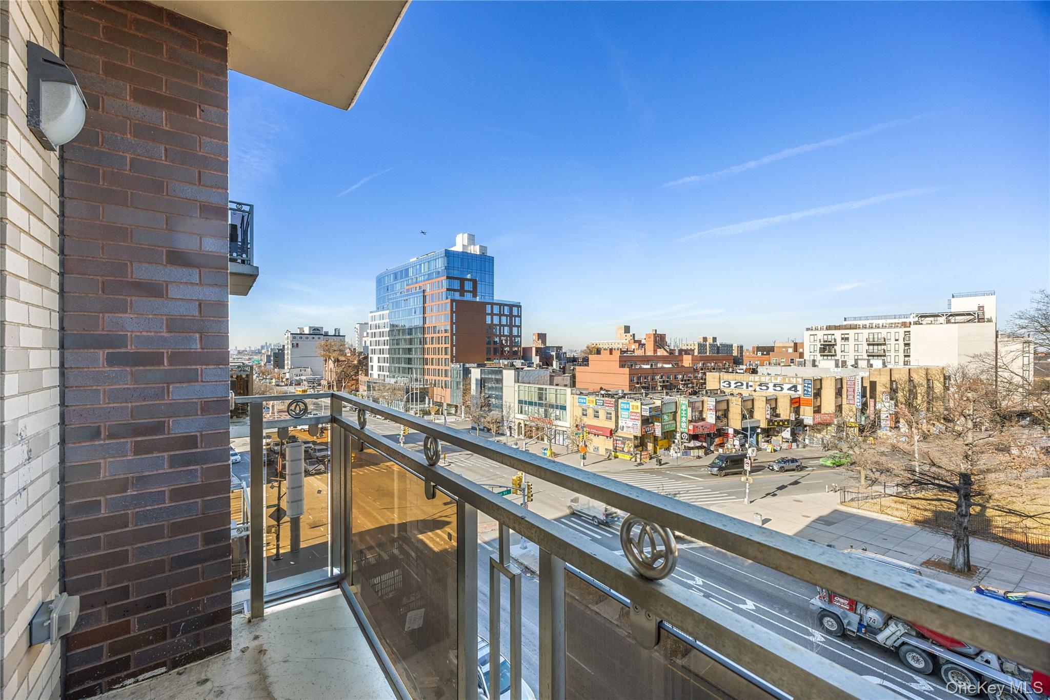138-12 Northern Boulevard, Unit 5D Queens, NY 11354 - Photo 18 of 22 a city view from a balcony with city view
