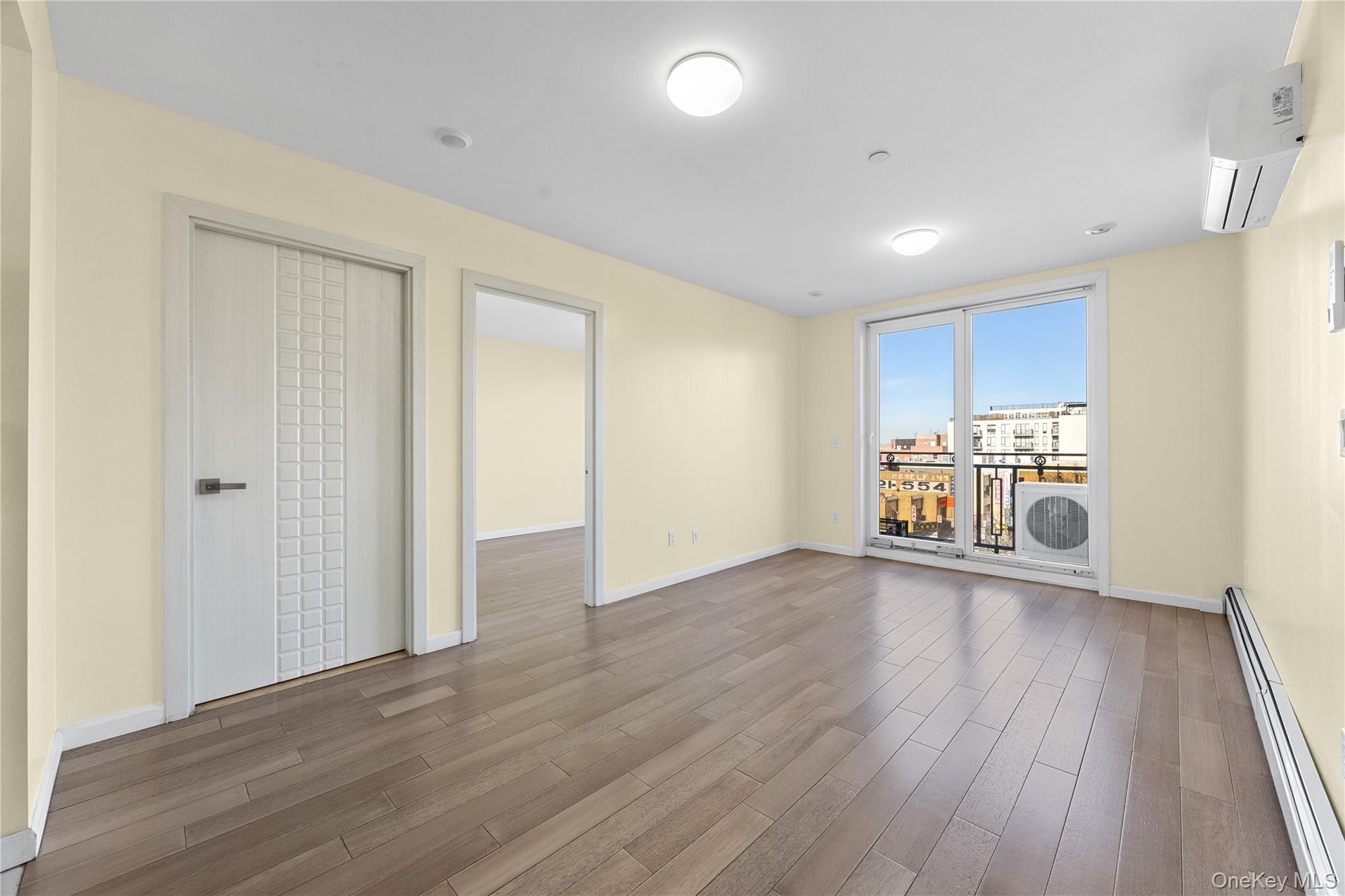 138-12 Northern Boulevard, Unit 5D Queens, NY 11354 - Photo 8 of 22 a view of a kitchen with a sink and wooden floor