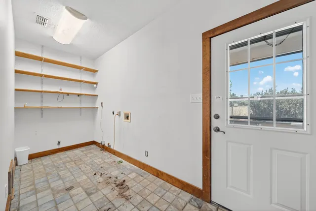 a view of a room with rack on the wall