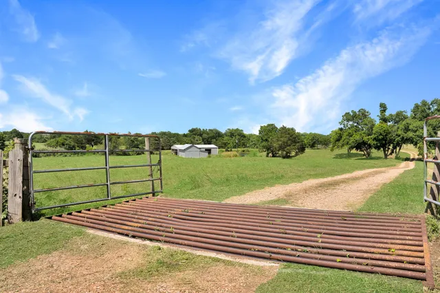 a view of a swimming pool with a yard
