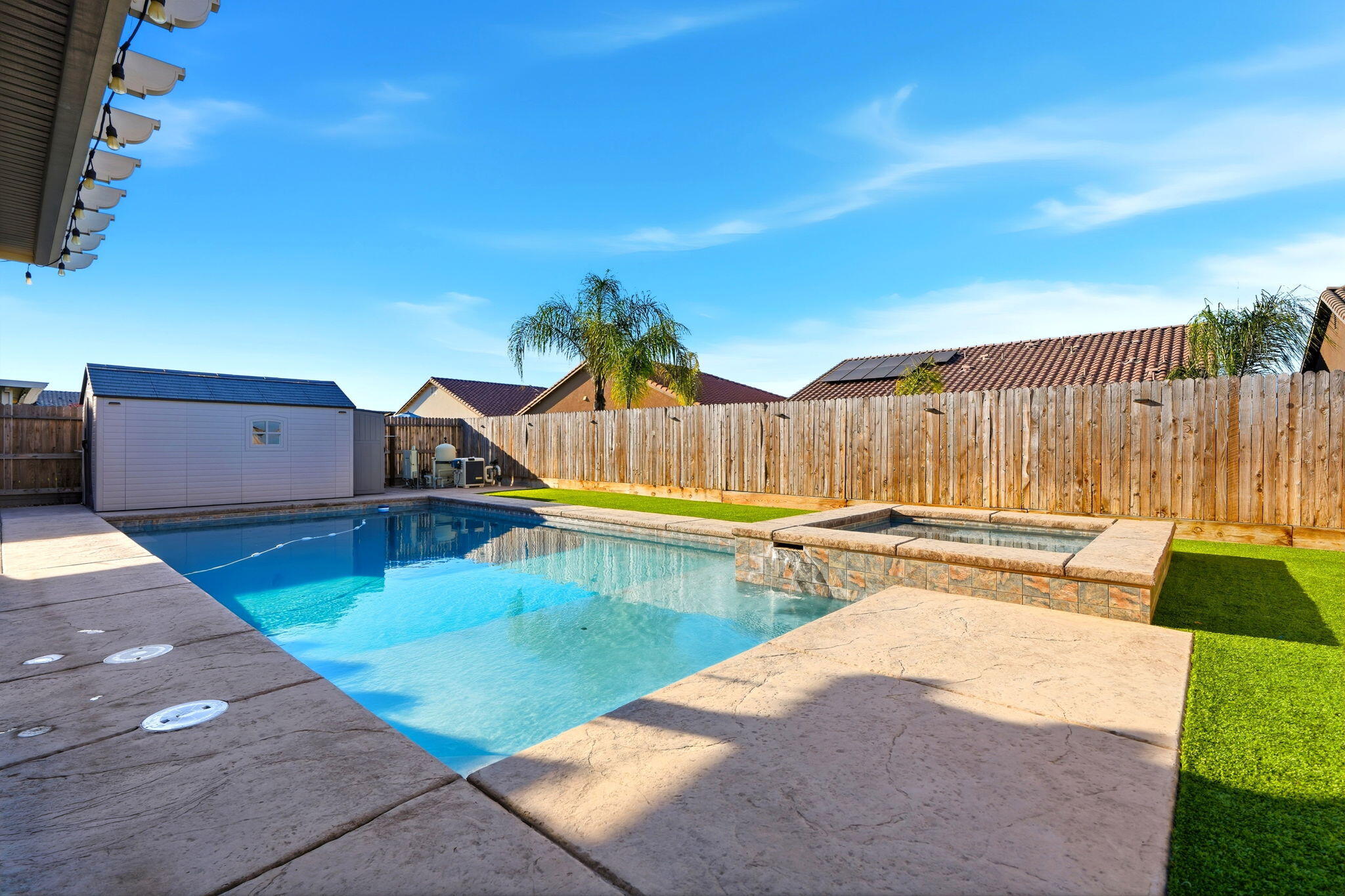 756 Strada Street Lemoore, CA 93245 - Photo 36 of 53 a view of a backyard with swimming pool