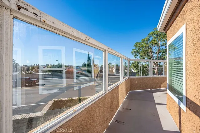 a view of balcony with a potted plant