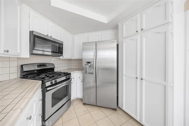 a kitchen with a stove microwave and refrigerator
