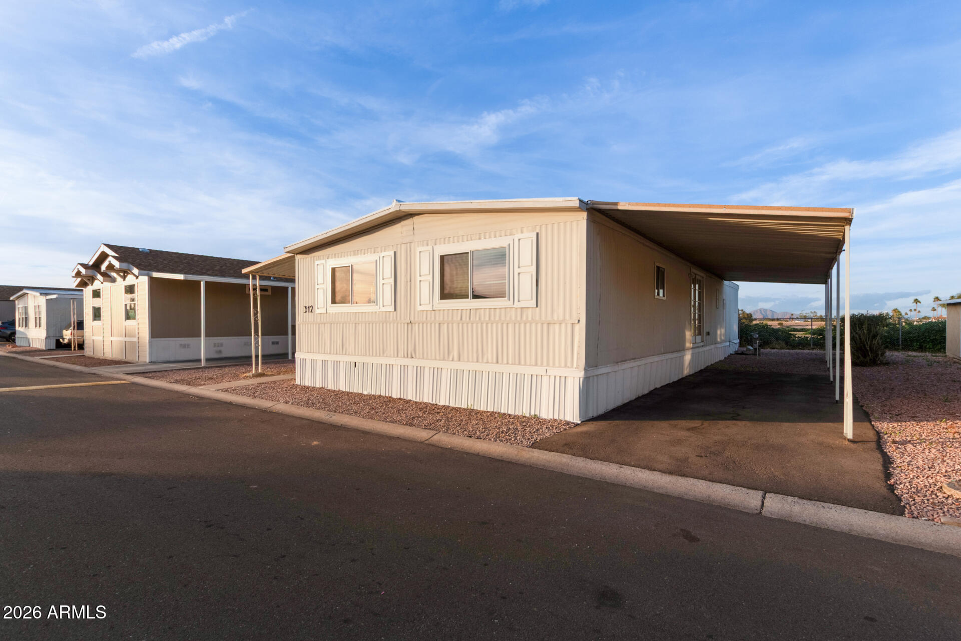 400 West Baseline Road, Unit 312 Tempe, AZ 85283 - Photo 7 of 32 a backyard of a house with table and chairs
