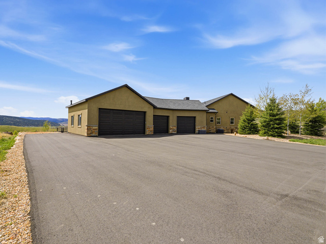 402 Shadow Hill Road Wanship, UT 84017 - Photo 65 of 90 View of front facade featuring stone siding and stucco siding