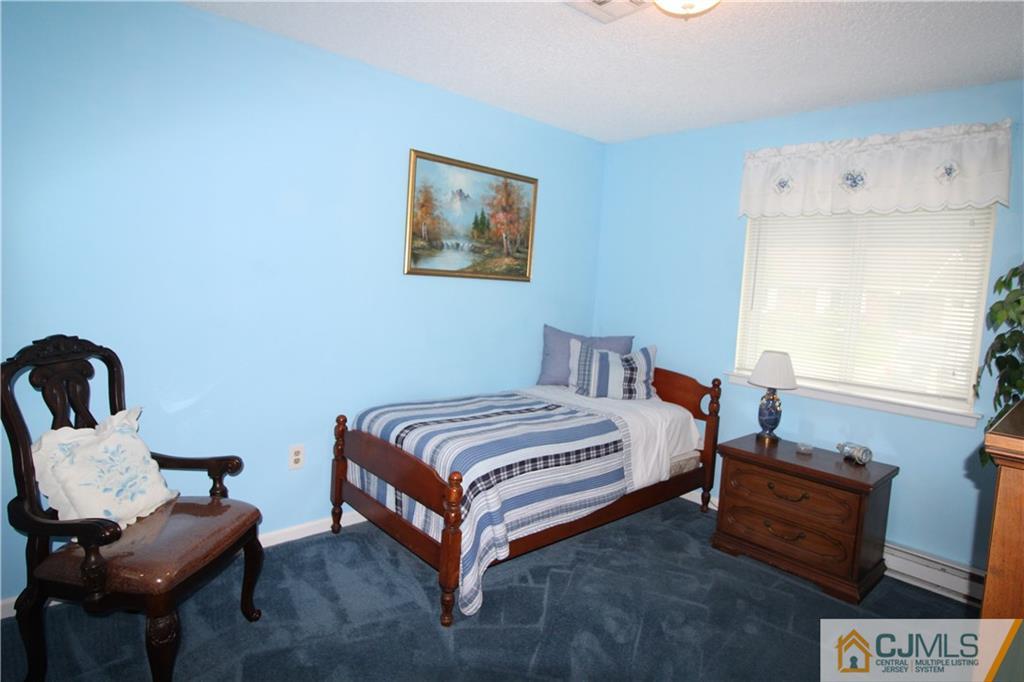438 A Belford Road Monroe Township, NJ 08831 - Photo 16 of 19 a bed room with a bed and a chair