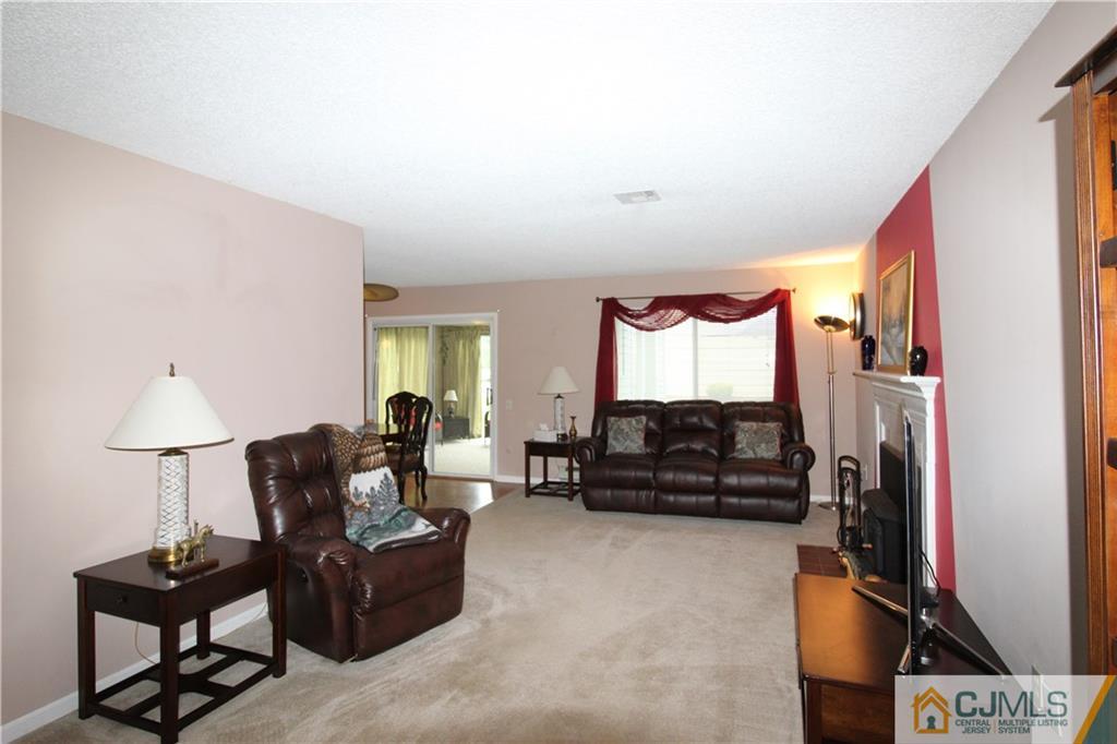 438 A Belford Road Monroe Township, NJ 08831 - Photo 5 of 19 a living room with furniture and a lamp