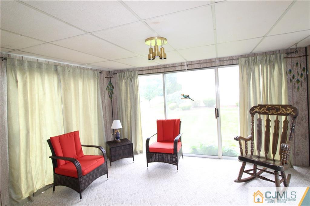 438 A Belford Road Monroe Township, NJ 08831 - Photo 6 of 19 a living room with furniture a rug and a window