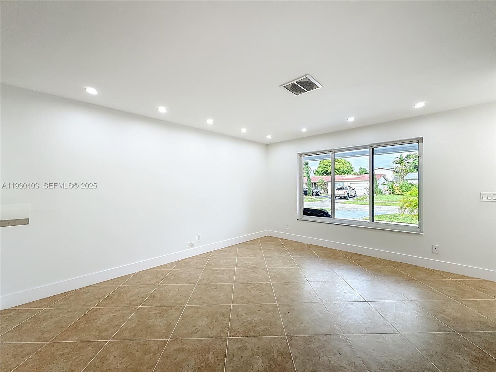 4008 Adams Street Hollywood, FL 33021 - Photo 11 of 54 an empty room with windows