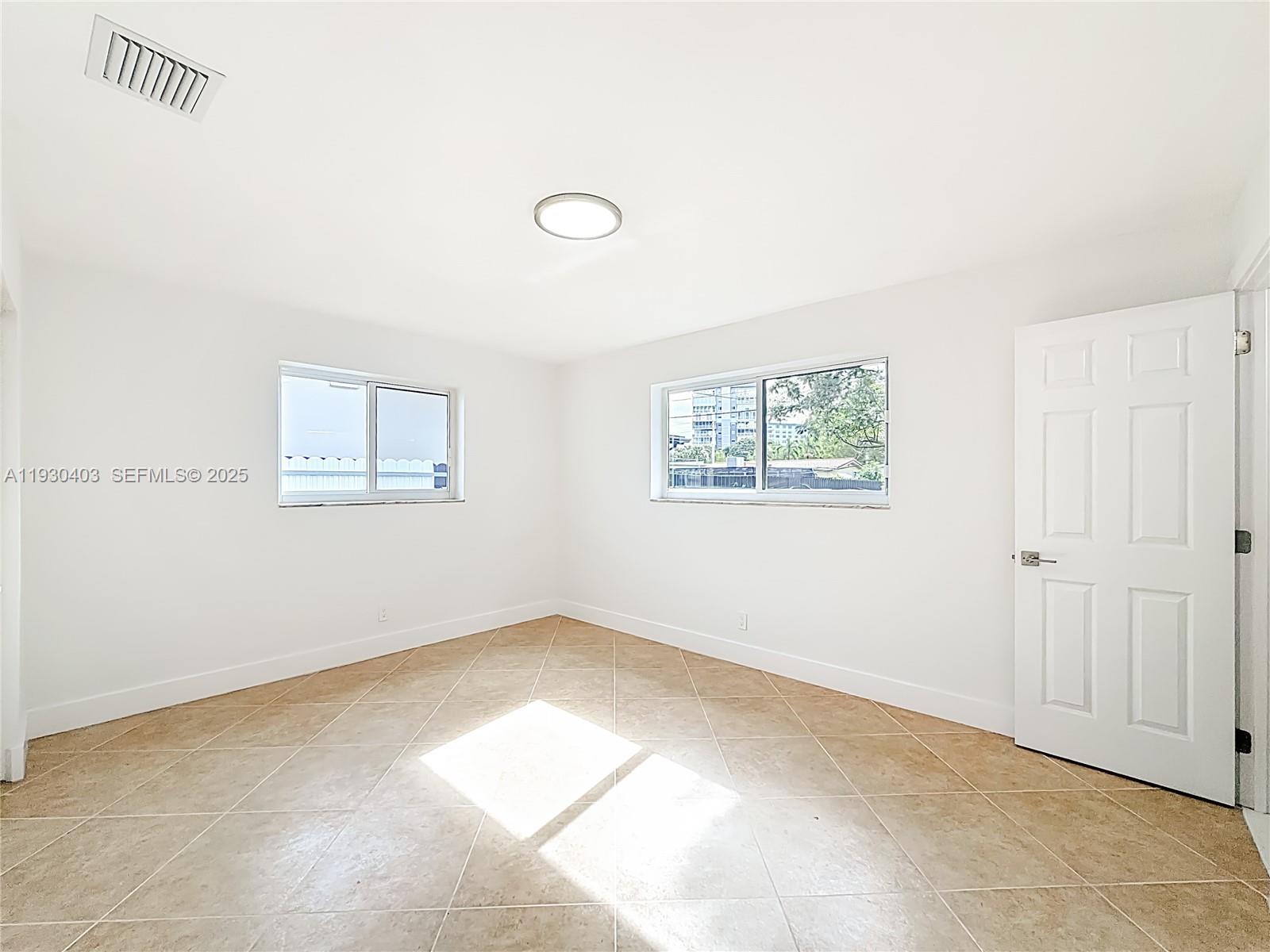 4008 Adams Street Hollywood, FL 33021 - Photo 21 of 54 an empty room with windows
