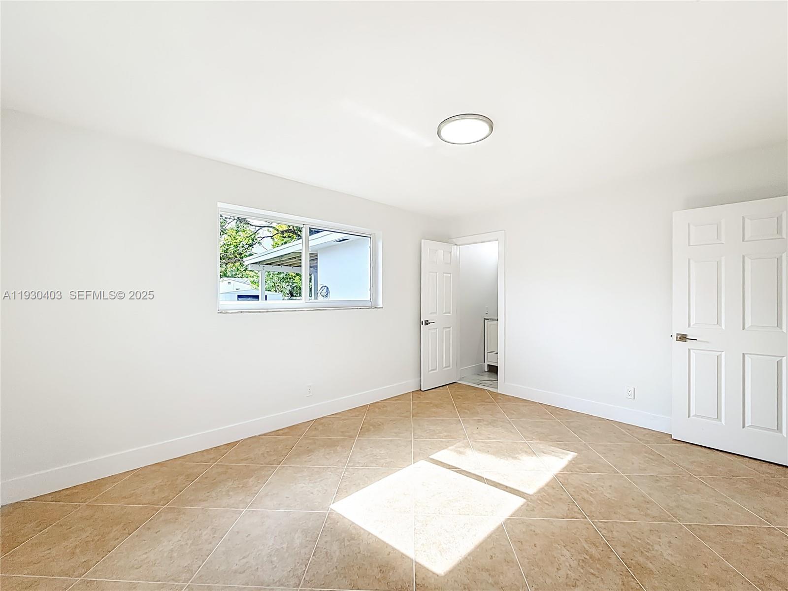 4008 Adams Street Hollywood, FL 33021 - Photo 22 of 54 an empty room with windows
