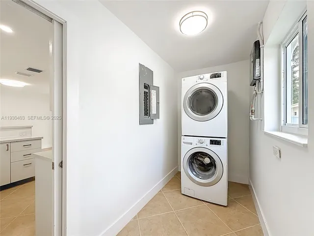 a view of a livingroom with wooden floor and a bathroom sink