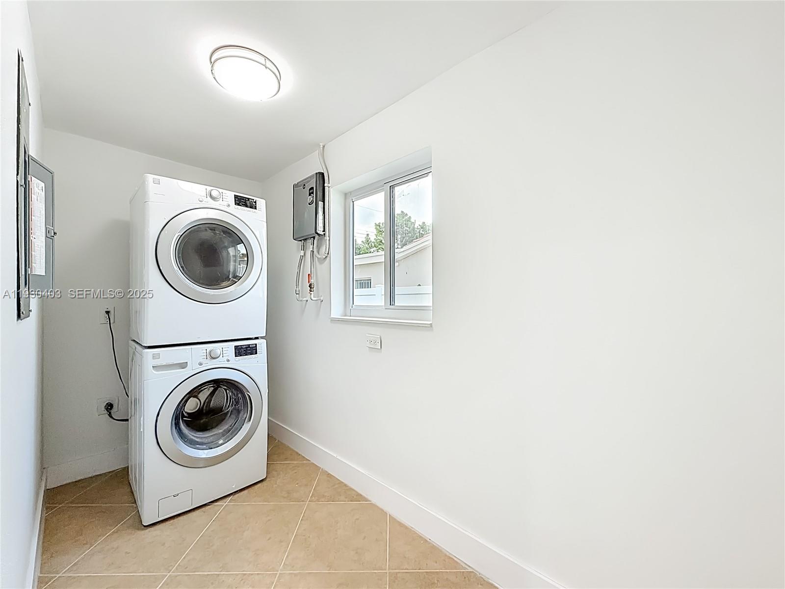 4008 Adams Street Hollywood, FL 33021 - Photo 29 of 54 a utility room with dryer and washer