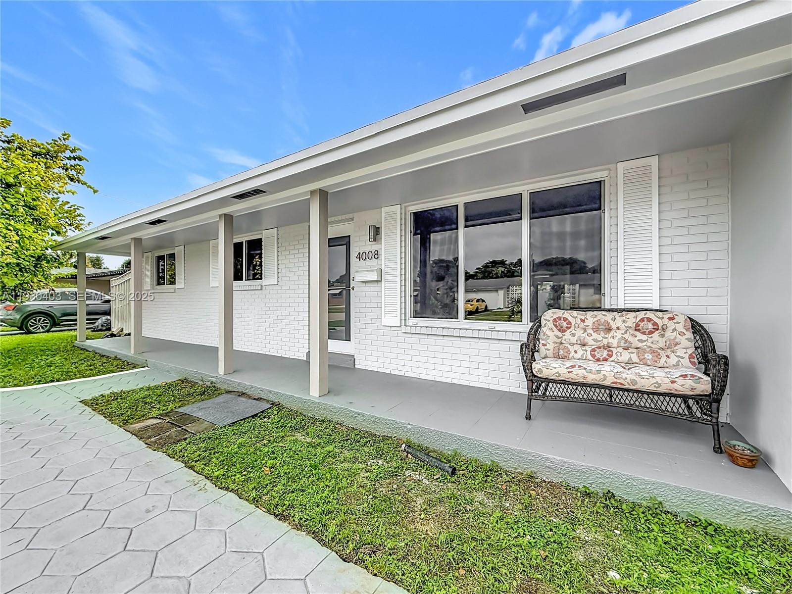 4008 Adams Street Hollywood, FL 33021 - Photo 3 of 54 a house view with a garden space