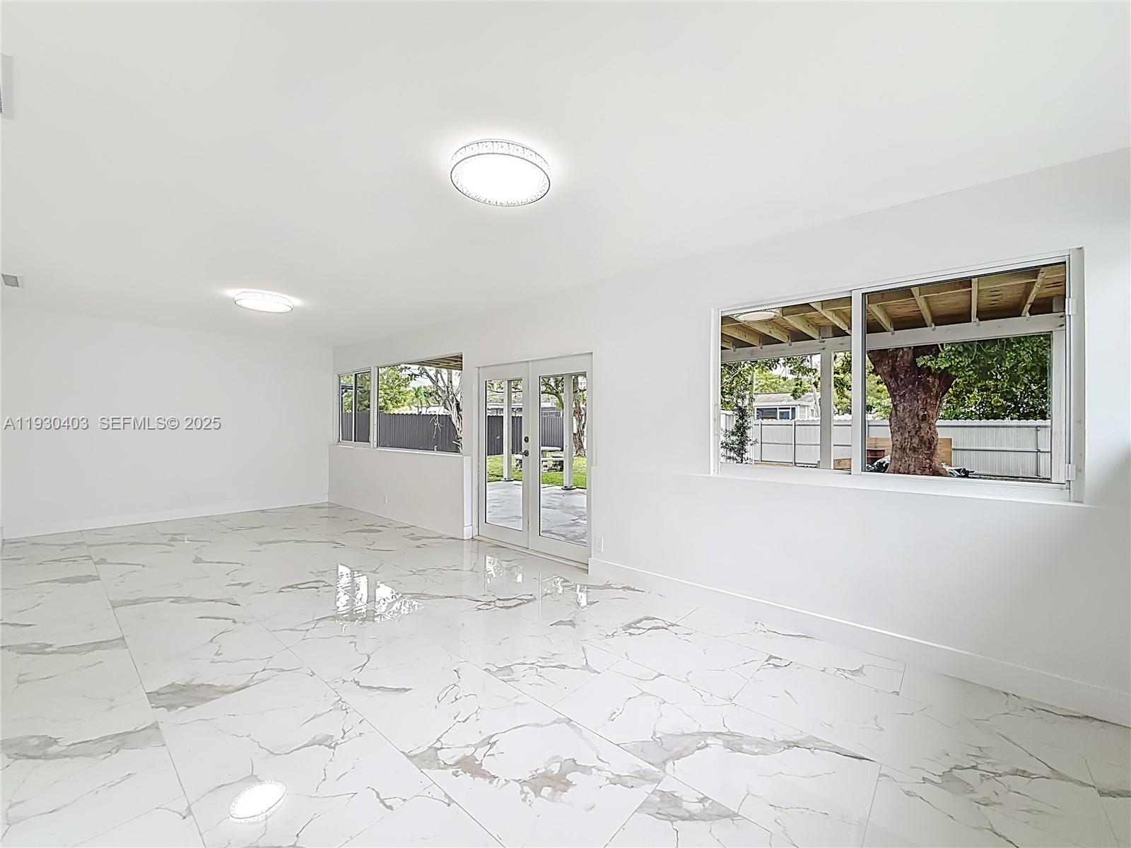 4008 Adams Street Hollywood, FL 33021 - Photo 32 of 54 a view of a livingroom with wooden floor and a window