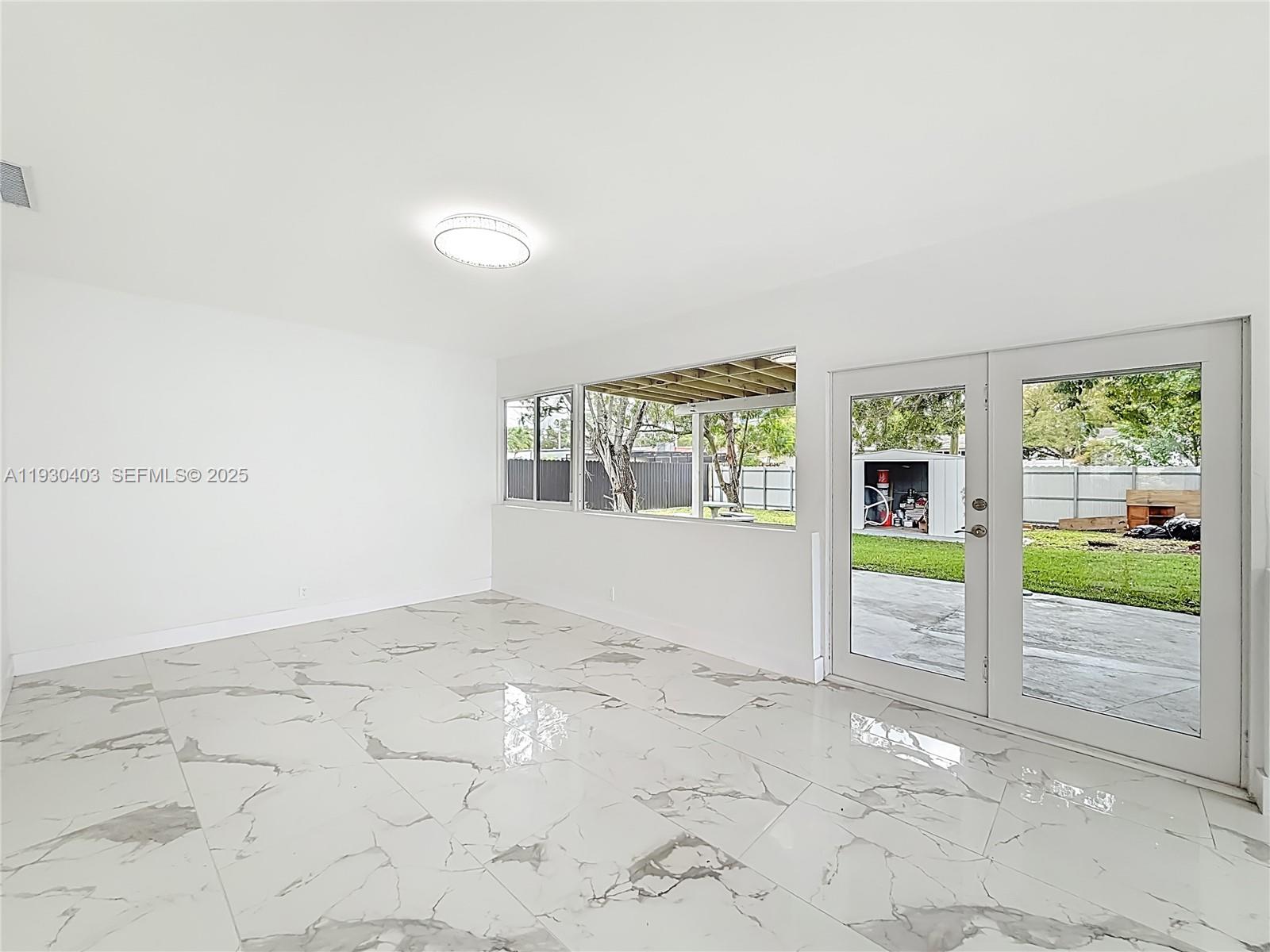 4008 Adams Street Hollywood, FL 33021 - Photo 33 of 54 a view of an empty room with a window