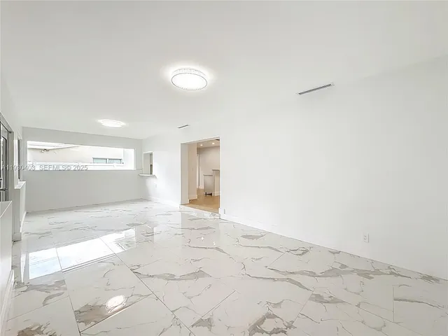 a view of an entryway of a house and a yard