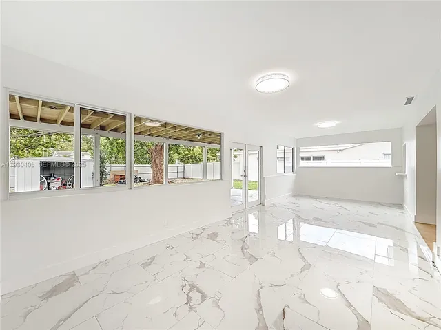 a view of an empty room with a window