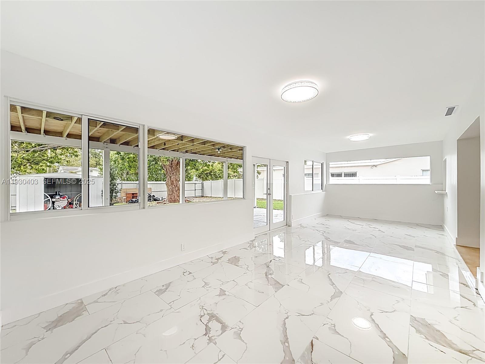 4008 Adams Street Hollywood, FL 33021 - Photo 36 of 54 a view of an empty room with a window