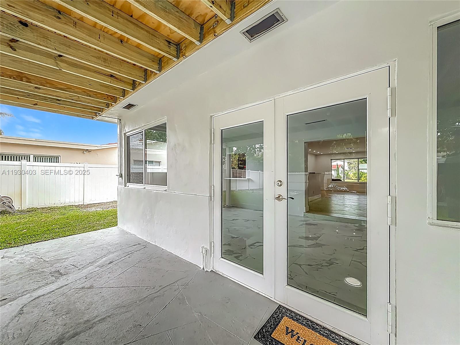 4008 Adams Street Hollywood, FL 33021 - Photo 38 of 54 a view of an entryway of a house and a yard