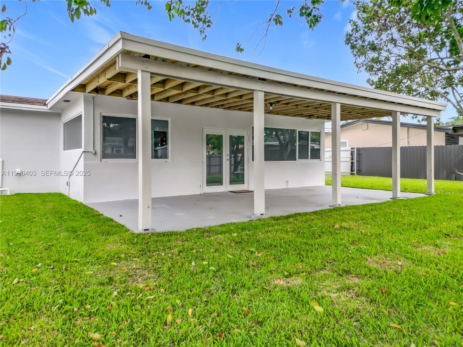 4008 Adams Street Hollywood, FL 33021 - Photo 45 of 54 a view of an house with backyard porch and a patio