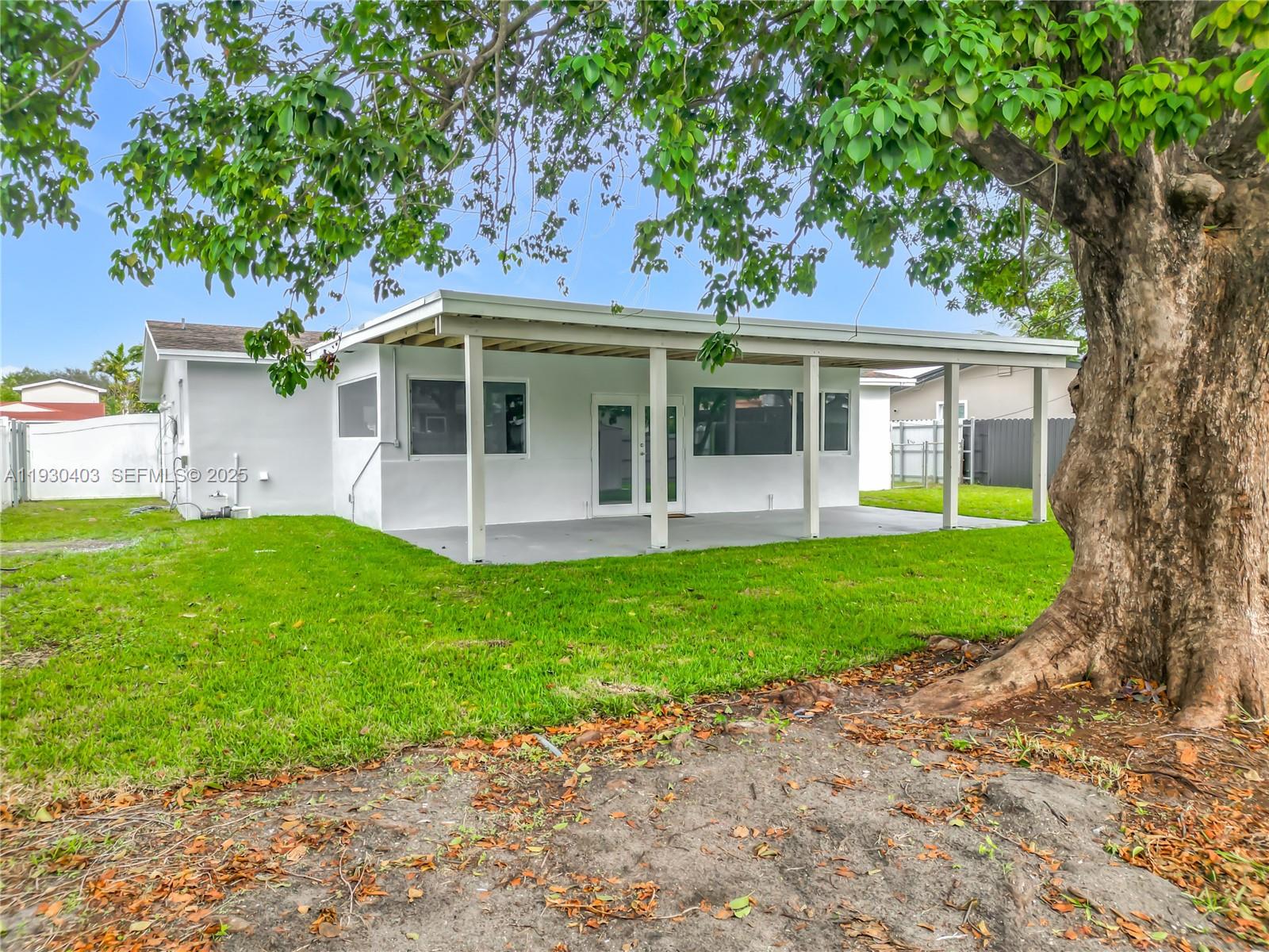 4008 Adams Street Hollywood, FL 33021 - Photo 46 of 54 front view of a house with a yard