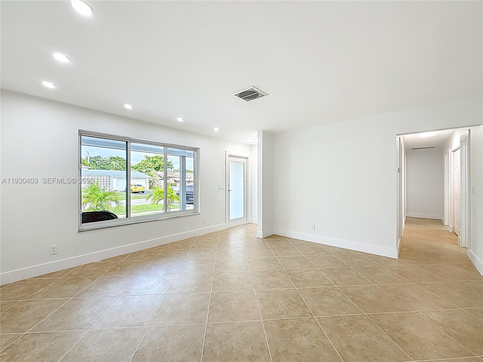 4008 Adams Street Hollywood, FL 33021 - Photo 6 of 54 a view of an empty room with a window