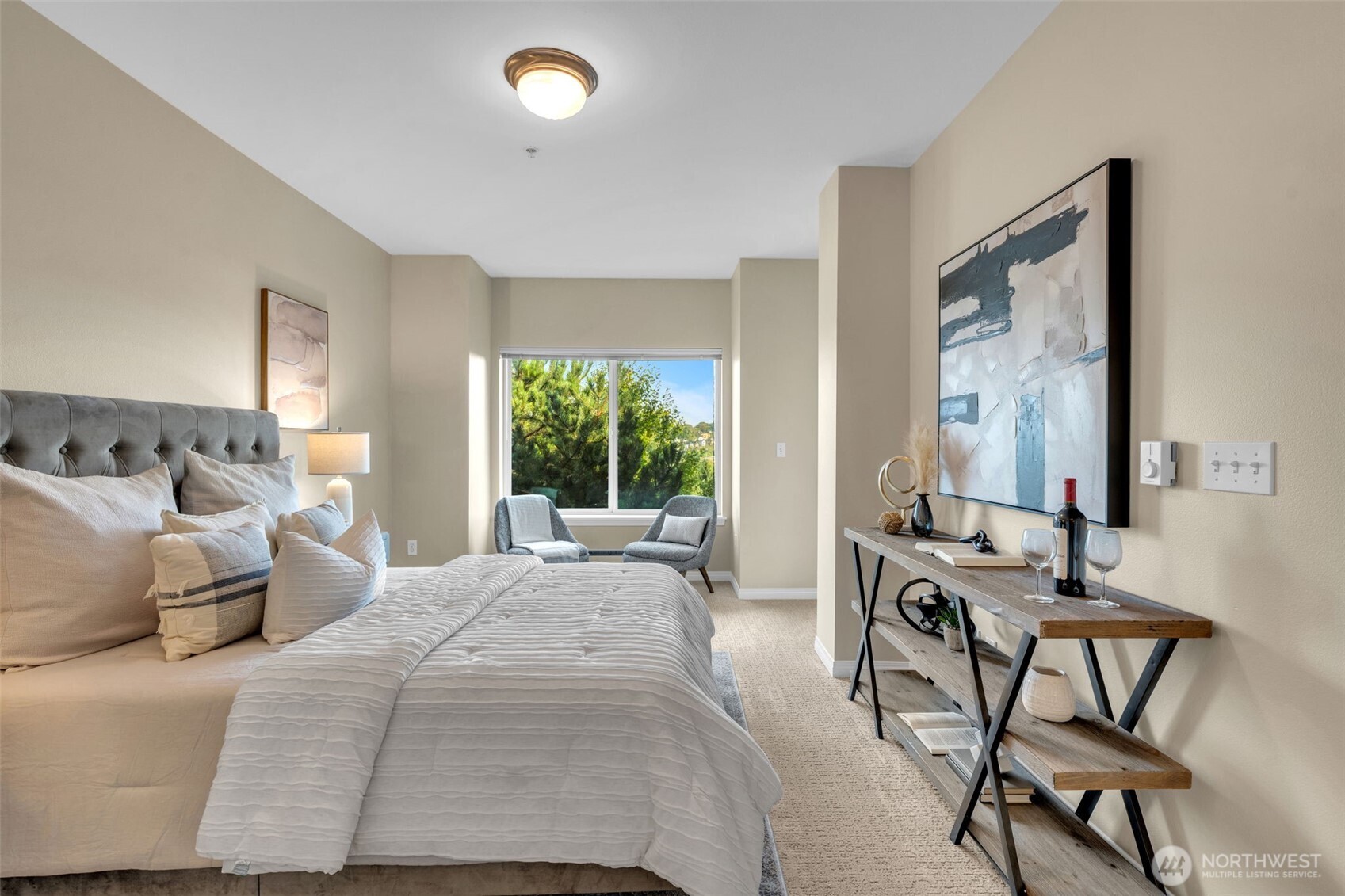 3112 Southwest Avalon Way, Unit 302 Seattle, WA 98126 - Photo 28 of 40 a bedroom with a bed and large windows