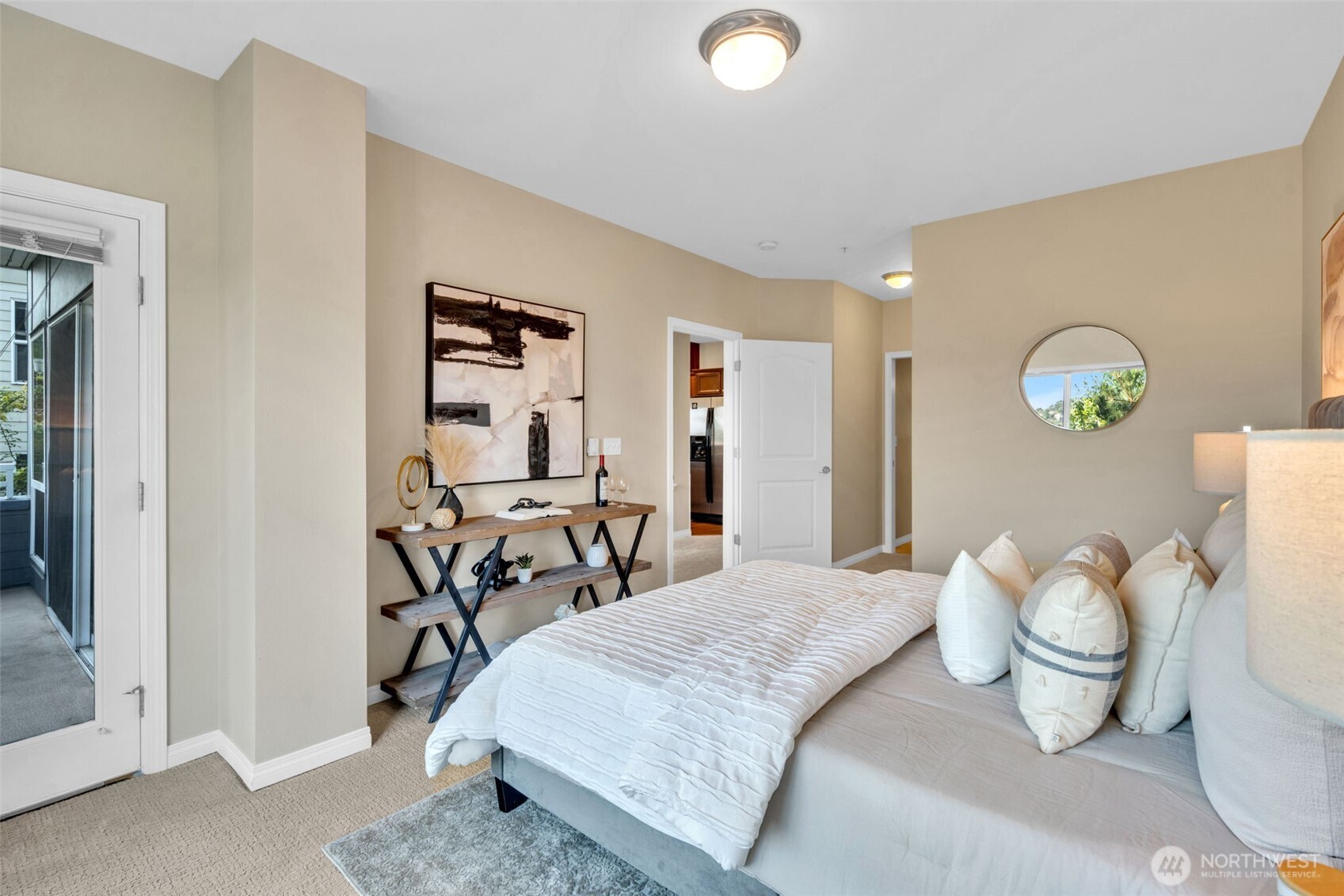 3112 Southwest Avalon Way, Unit 302 Seattle, WA 98126 - Photo 30 of 40 a bedroom with a bed and wooden floor